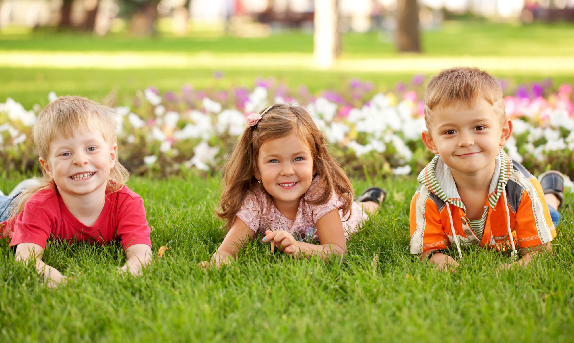 http://www.dreamstime.com/royalty-free-stock-photo-three-happy-children-lying-grass-two-boys-girl-lawn-image33061395